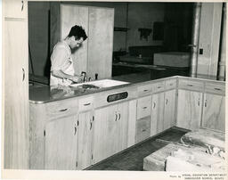 Student working on kitchen construction project, ca. 1954