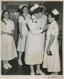 Graduating nurse getting a pin, ca. 1951