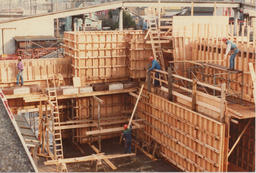 Carpentry students work on wooden frame, ca. 1980