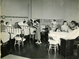 Student nurses caring for patients, ca. 1959