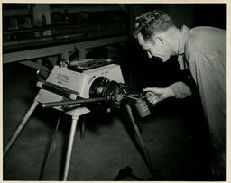 Engineering student oiling a chuck, ca. 1949