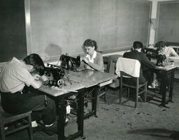 Tailoring students working on sewing machines