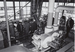 Students in hardhats on a tour of industrial building