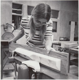 Student cutting wood