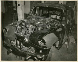 Car in body shop, ca. 1950