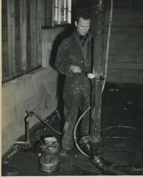 Plumbing student working on a pipe, ca. 1949