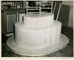 A wooden tiered oval structure, ca. 1951