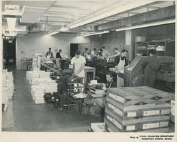 Group of students working at printing press