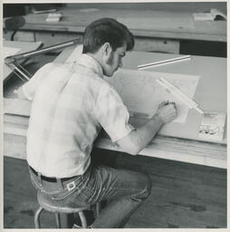 Student working at drafting table