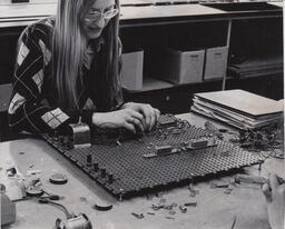Student working on a circuit board