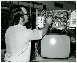 Student working on television parts