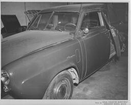 Car in body shop, ca. 1951