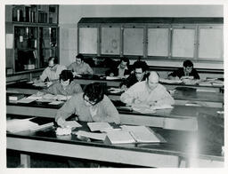 Students working at desks in a classroom