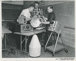 Students working with electronic radio equipment and oscilloscope, ca. 1963