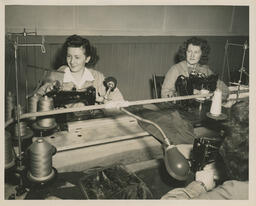 Two Power Sewing students at sewing machines