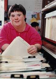 Student at a filing cabinet