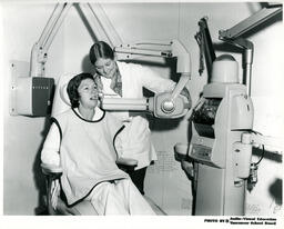 Person getting dental x-ray, ca. 1972