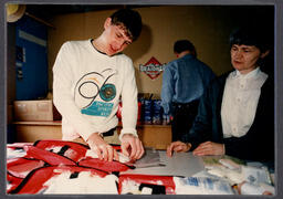 Student fills first aid kits