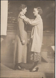 Student in the Provincial Training program pinning the shoulder of a dress, ca. 1934
