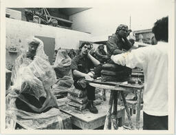 Model poses for student doing a sculpture