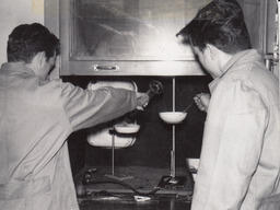 Two students doing chemistry