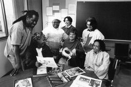 Group of students at a table in a classroom