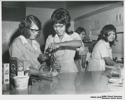 Students in the Family Aide Program working in a kitchen