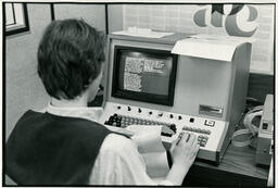 Person working at old computer
