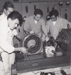 Four students at a circular machine