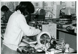Electronics students work on a motor