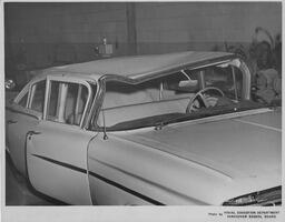 Car with damaged roof, ca. 1959