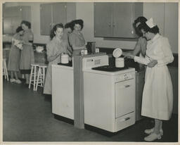Nursing students working in a kitchen classroom, ca. 1949