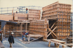 Carpentry students work on wooden frame