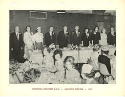 Secreterial department students and staff at long tables, ca. 1963