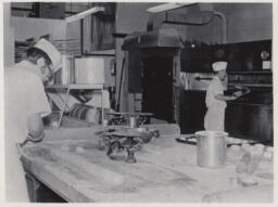 Baking students in kitchen