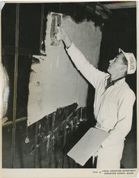 Student plastering a wall, ca. 1955
