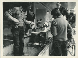 Students soldering outside