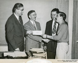 Plastering student receiving diploma, ca. 1955