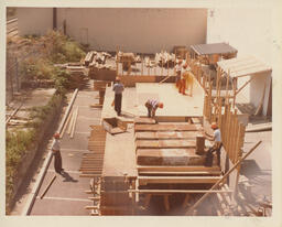 Carpentry students work on wooden frame, ca. 1980