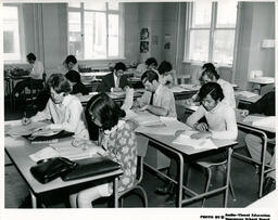 Students at desks in a a classroom, ca. 1972