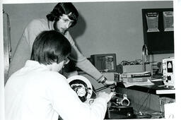 Students working with an electronic instrument