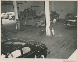 Cars in an auto shop classroom, ca. 1953