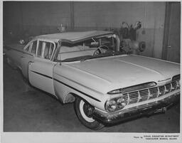 Chevrolet with dented roof, ca. 1959