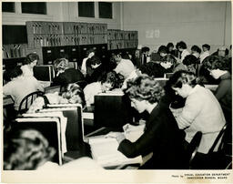Large classroom of students working at their desks, ca. 1960