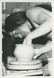 Student at a pottery wheel