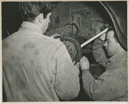 Auto students working on wheel, ca. 1950