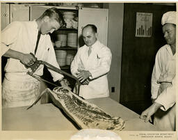 Student butchering meat, ca. 1954