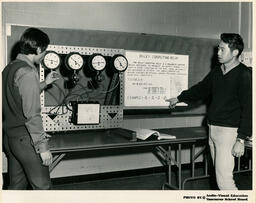 Engineering students with a Bailey Computing Relay machine, ca. 1970