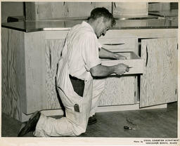 Student working on kitchen drawer, ca. 1950