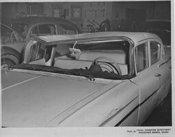 Car with dented roof, ca. 1959